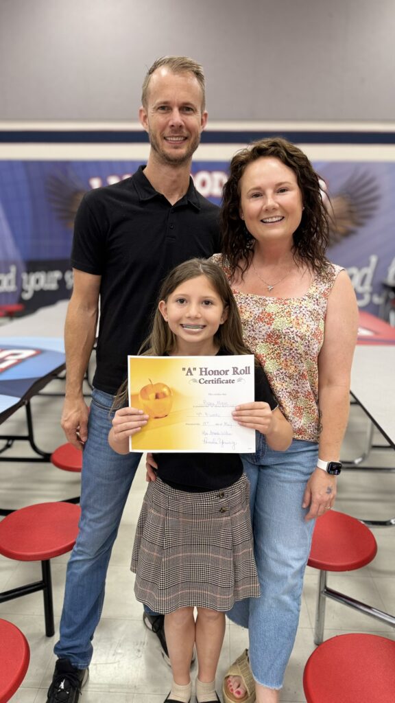 Poppy Mixon with her parents JD and Holly at the Lakewood Awards Ceremony