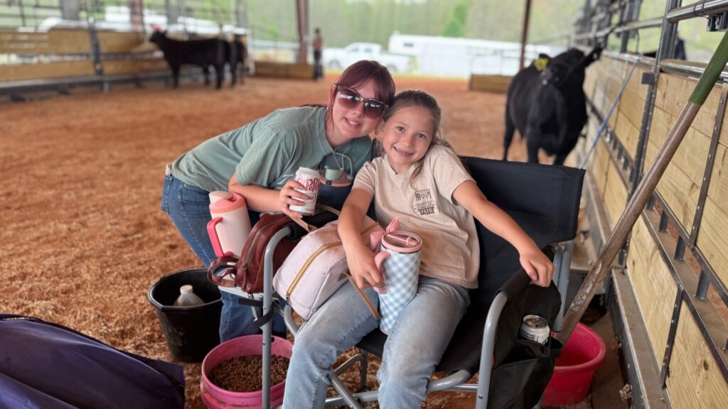 Poppy Mixon with her older sister Grey Mixon at the show barn
